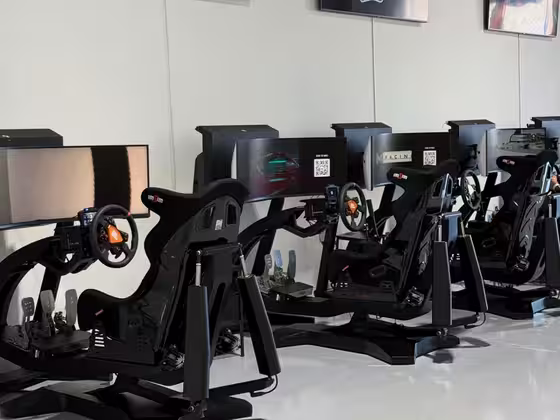 Twenty ImSim simulators lined up on the floor at SIM1 Racing, USA.